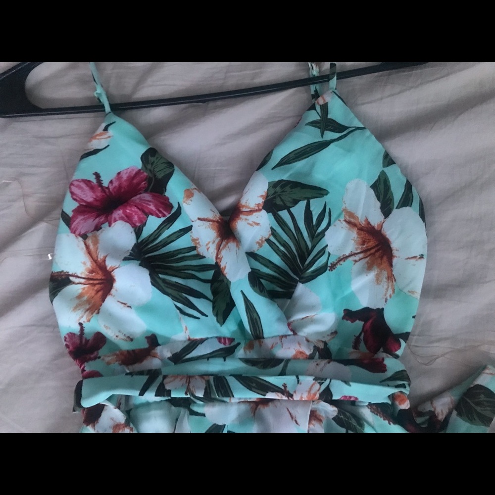 mint green flowery dress with slit on the side and loose ruffles on the bottom